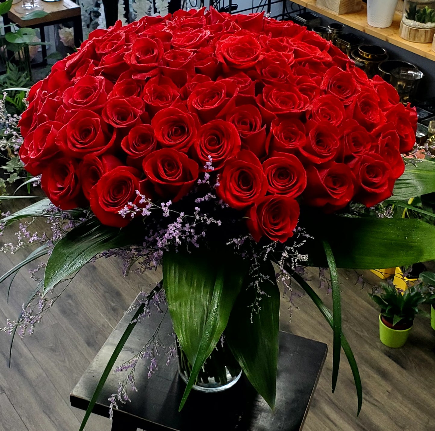 100 Red roses in a vase